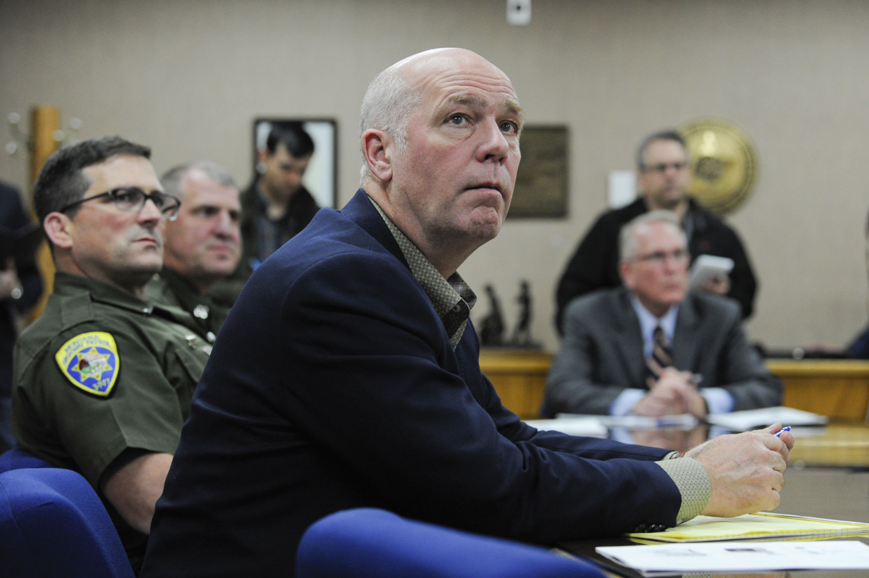 Congressman Greg Gianforte listens to a presentation Tuesday